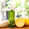 Olej do Ciała Happiness, butelka 100 ml i cytryny